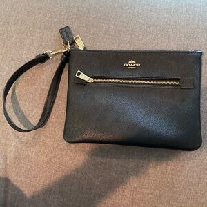 Black Coach Wristlet used one time.